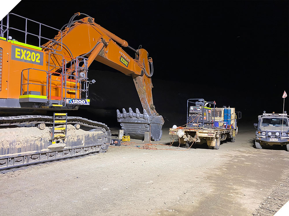 Large Orange Excavator — NQHF Pty Ltd in Home Hill, QLD